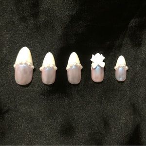 These are self designed pearly chrome 3D false nails